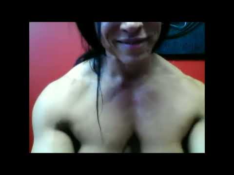 (+18) female bodybuilder flexing PECS