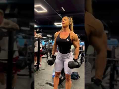 Sexy female bodybuilder training her huge muscular arms – Raluca Raducu